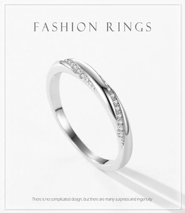 Macro detail of S925 sterling silver ring with twisted band and pavé cubic zirconia