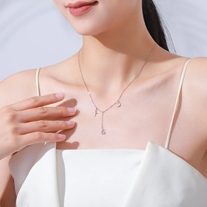 S925 sterling silver Y-shaped necklace with star and moon charms on model