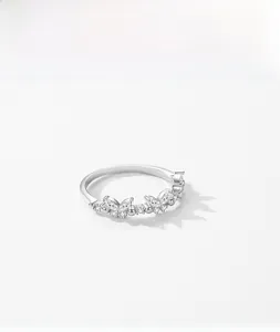 Macro shot of S925 sterling silver ring with butterfly and leaf designs with cubic zirconia