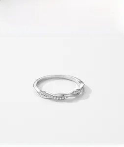 Detailed view of S925 sterling silver ring featuring twisted pavé zircon band design