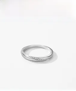 Close-up of S925 sterling silver interlaced ring with micro-pave cubic zirconia accents
