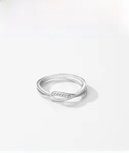 Macro shot of S925 sterling silver twisted ring with shimmering micro-paved cubic zirconia