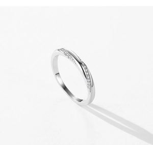 Macro shot of S925 silver ring featuring Mobius twist design and micro-paved gemstones