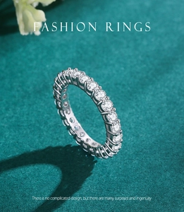 Macro shot of S925 silver eternity ring featuring full circle pavé diamonds on green backdrop