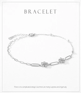 Detail of S925 sterling silver flower bracelet with pavé diamonds and adjustable chain