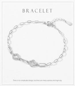 Close-up of S925 silver clover bracelet with sparkling pave zircon micro-inlays