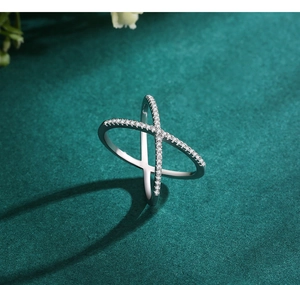 Macro detail of S925 sterling silver X-shaped criss-cross ring with micro-pave zircons
