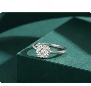 Macro shot of S925 sterling silver ring with micro-paved gems on green texture