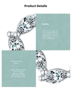 Detailed view of S925 silver flower earrings with cubic zirconia and mirror finish
