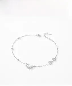 Close-up of S925 sterling silver heart bracelet with LOVE engraving and zircons