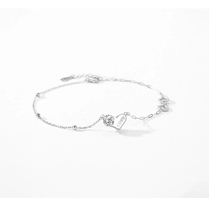 Detailed shot of S925 silver heart bracelet with LOVE engraving and small zircon