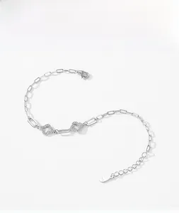 Macro detail of S925 sterling silver four-leaf clover bracelet with zircon pavé setting
