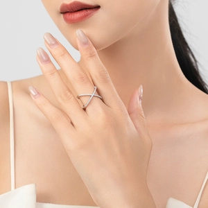 Cross-shaped S925 silver ring with sparkling micro-pave zircons worn on finger