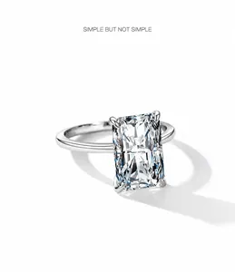 Macro view of rectangular radiant cut zircon set in silver four-prong solitaire ring