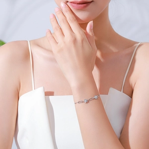 Elegant S925 sterling silver flower bracelet with micro-pave crystals on female wrist