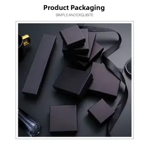 Minimalist matte black jewelry packaging box set with elegant satin ribbons and textures