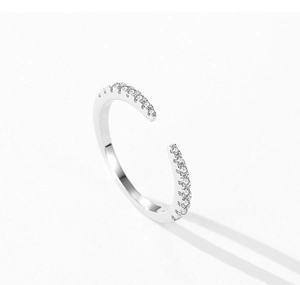 Macro shot of 925 sterling silver open ring featuring pave-set sparkling zircon stones