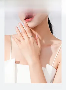 Close-up of minimalist 925 silver square ring on finger for elegant layered style