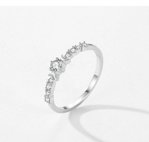 Macro detail of S925 sterling silver stamp and six-prong moon setting with round zircon