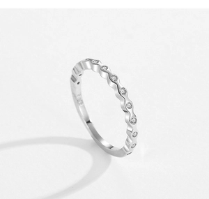 Detail of S925 sterling silver ring featuring a wave design with sparkling zircons