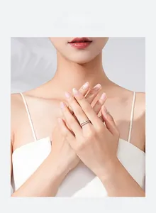 Close-up of elegant S925 silver heart-shaped zircon ring on a model hand