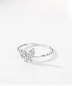 Macro detail of S925 sterling silver butterfly ring with sparkling pavé crystal settings