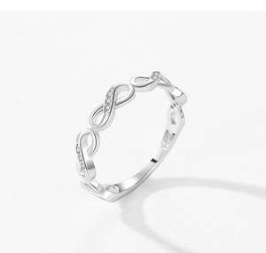 Macro detail of S925 sterling silver infinity ring with micro-pave cubic zirconia