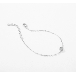 Macro shot of S925 sterling silver bracelet with sparkling zircon circular charm detail