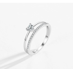 Macro shot of S925 sterling silver stamp and heart-shaped zircon on a dual-band ring