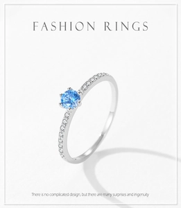 Close-up of S925 silver ring featuring blue zircon and pavé setting details