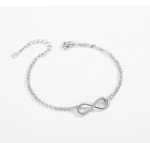 Detail of S925 sterling silver infinity bracelet with pavé cubic zirconia and adjustable chain
