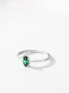 Detail showing S925 sterling silver hallmark and oval green emerald zircon setting