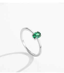 Macro shot of S925 sterling silver stamp on oval green emerald zircon ring