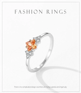 Detail view of champagne zircon square-cut main stone with small side diamonds