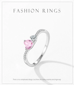 Detail of S925 silver ring featuring pink and clear heart-shaped cubic zirconia stones