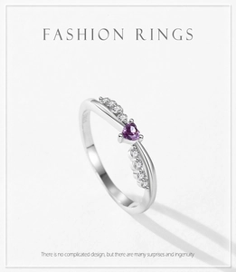 Detail of S925 silver ring featuring a heart-shaped purple zircon and twisted pavé band