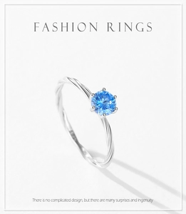Macro shot of S925 sterling silver ring featuring a blue zircon in a six-prong setting