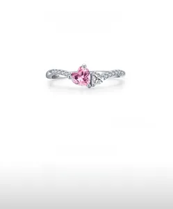 Close-up of S925 sterling silver ring featuring a pink heart zircon and side accents