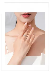 Detail of S925 silver ring featuring a sparkling pink heart-shaped zircon on a hand