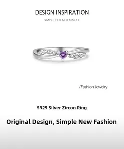 Detail of S925 silver ring featuring a purple heart zircon and crossed wave bands