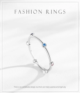 Detail of s925 silver minimalist ring featuring micro-set colorful zircon gemstones