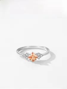 Macro detail of S925 silver ring featuring champagne princess cut zircon and side diamonds
