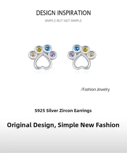 Detailed shot of S925 silver animal paw stud earrings with colorful zircon heart details