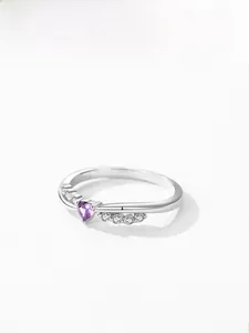Detail of S925 silver ring featuring purple heart zircon and crossed pavé diamond band