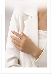 Detail showing a slim S925 silver ring with colorful zircons on a model finger