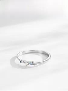 Detail of S925 silver ring featuring five colorful round zircons on a thin band