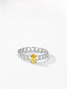 Close-up of S925 silver chain ring with a large oval yellow cz stone in four-prong setting