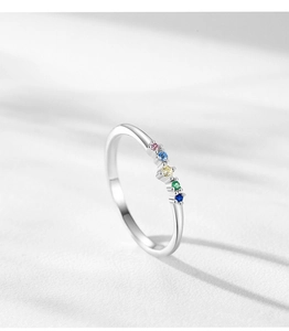 Macro view of dainty S925 silver ring featuring five colorful rainbow zircon stones