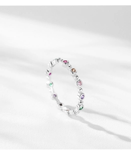 Detail of S925 silver rainbow ring featuring colorful bezel-set zirconia gemstones