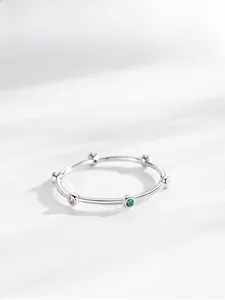 Detailed macro shot of an S925 silver ring featuring colorful small round gemstones